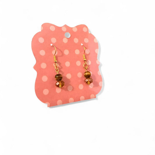 Handmade tigers eye bead and orange glass crystal earrings on a gold toned hook.